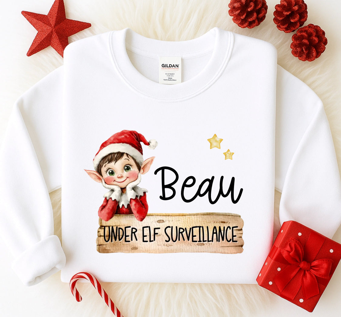 Personalised under elf surveillance sweatshirt
