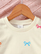 Bow sweatshirt and flares